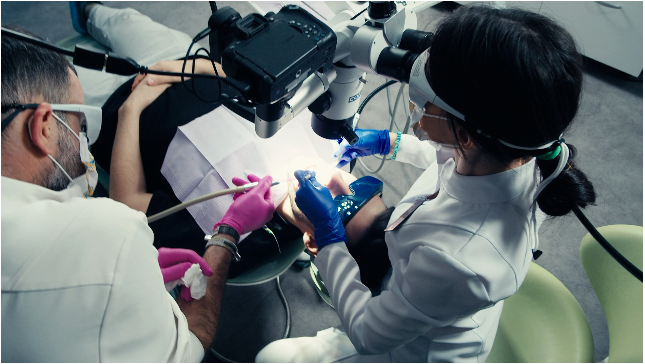 doctors working with a microscope